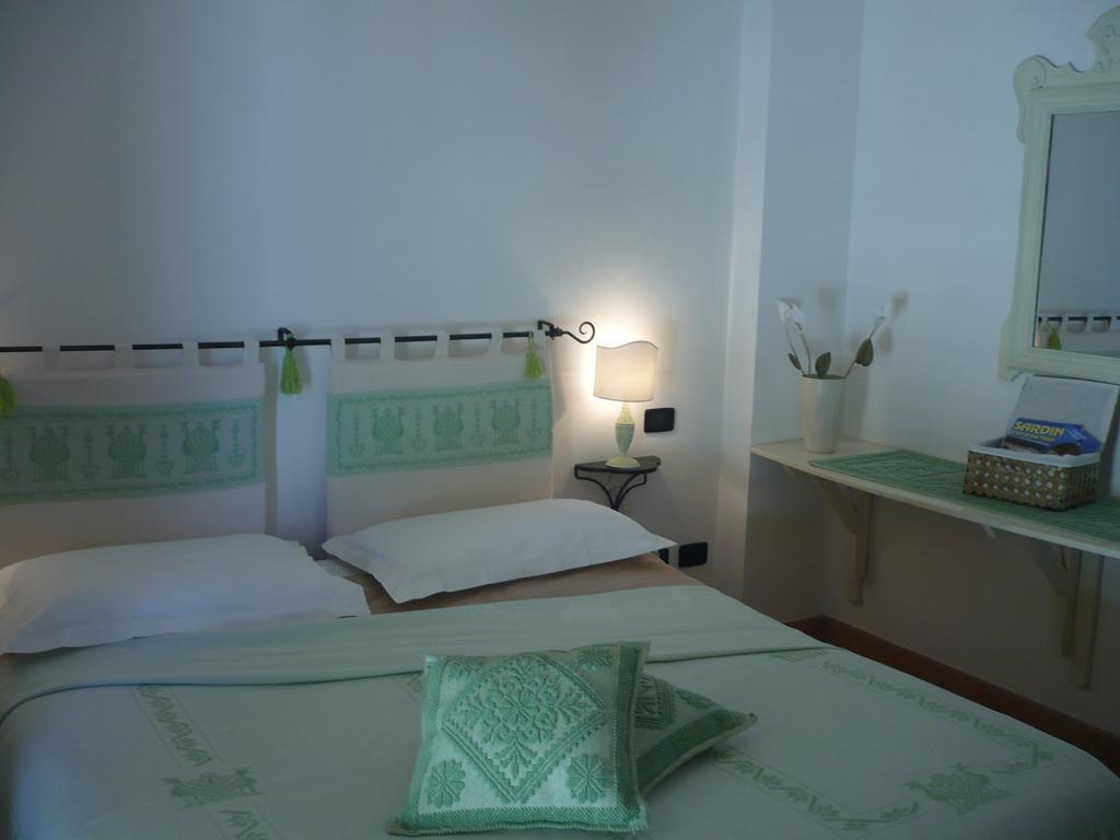 Apartamento Le Pavoncelle Alguer Habitación foto